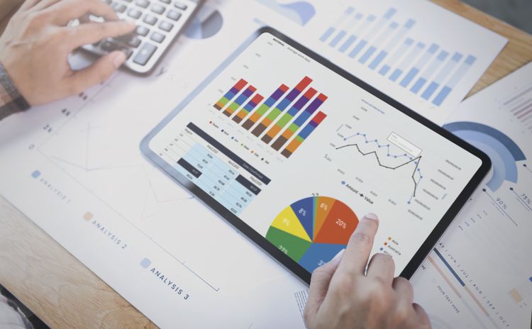 businesswoman-using-tablet-analysis-graph-company-finance-strategy-statistics-success-concept-planning-future-office-room (1).jpg