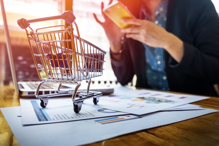 cropped-image-woman-inputting-card-information-key-phone-laptop-while-shopping-online (1) (1).jpg