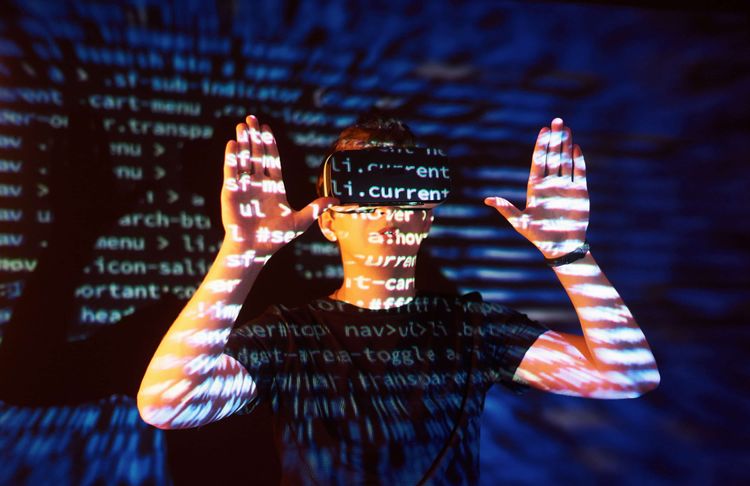 double-exposure-caucasian-man-virtual-reality-vr-headset-is-presumably-gamer-hacker-cracking-code-into-secure-network-server-with-lines-code (1).jpg