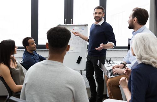 business-team-discussing-their-ideas-while-working-office (1).jpg