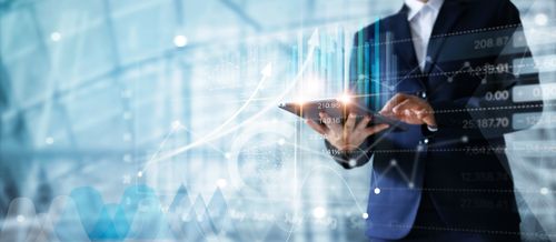 businessman-using-tablet-analyzing-sales-data-economic-growth-graph-chart (1).jpg