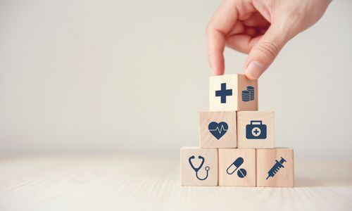 health-insurance-concept-reduce-medical-expenses-hand-flip-wood-cube-with-icon-healthcare-medical-coin-wood-background-copy-space (2).jpg