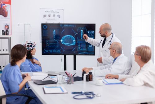 physician-pointing-medical-radiography-hospital-coworkers-analysing-brain-sickness-presentation-using-high-tech-meeting-room (1).jpg