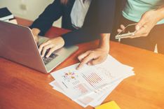 persons-working-with-documens-laptop (1).jpg